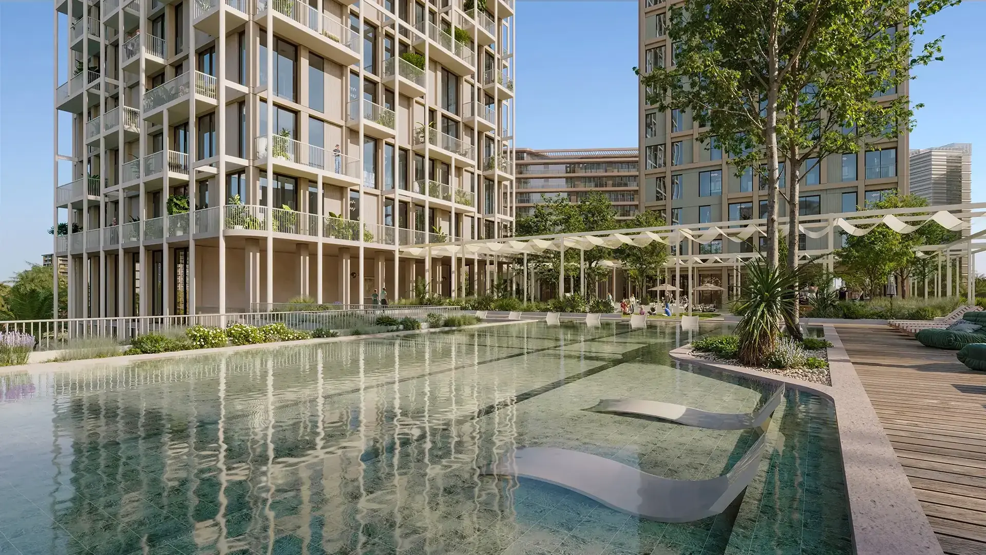 Enta Mina – landscaped pool with in-water loungers beside a residential tower