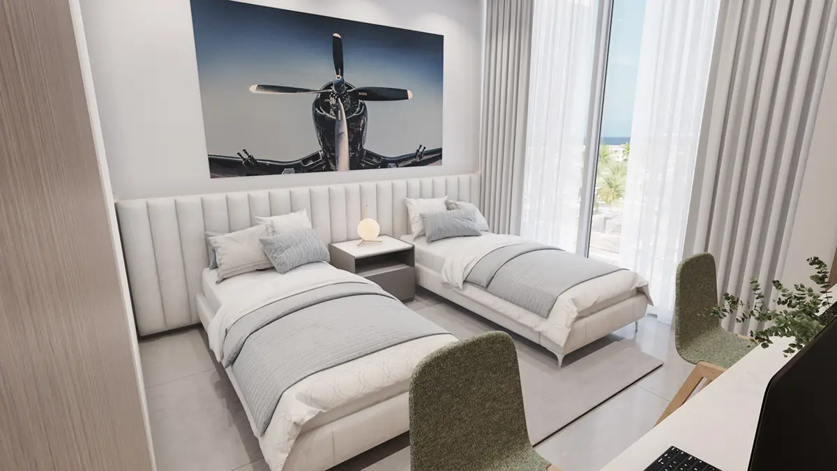 Gateway Residences II – twin bedroom with two single beds and a study desk