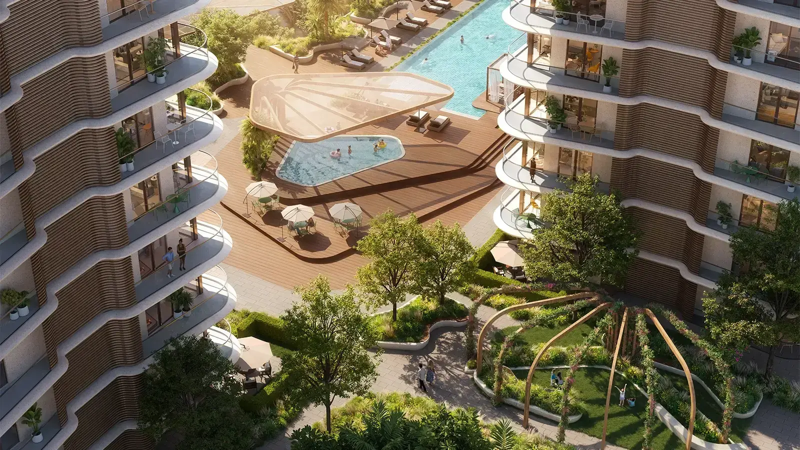 Lunara – aerial view of the pool deck and gardens between curved balcony towers