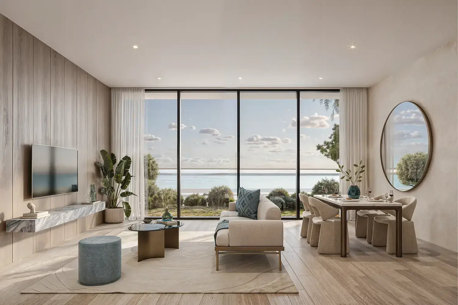 Mirasol – living room with sofa, dining table and floor-to-ceiling windows