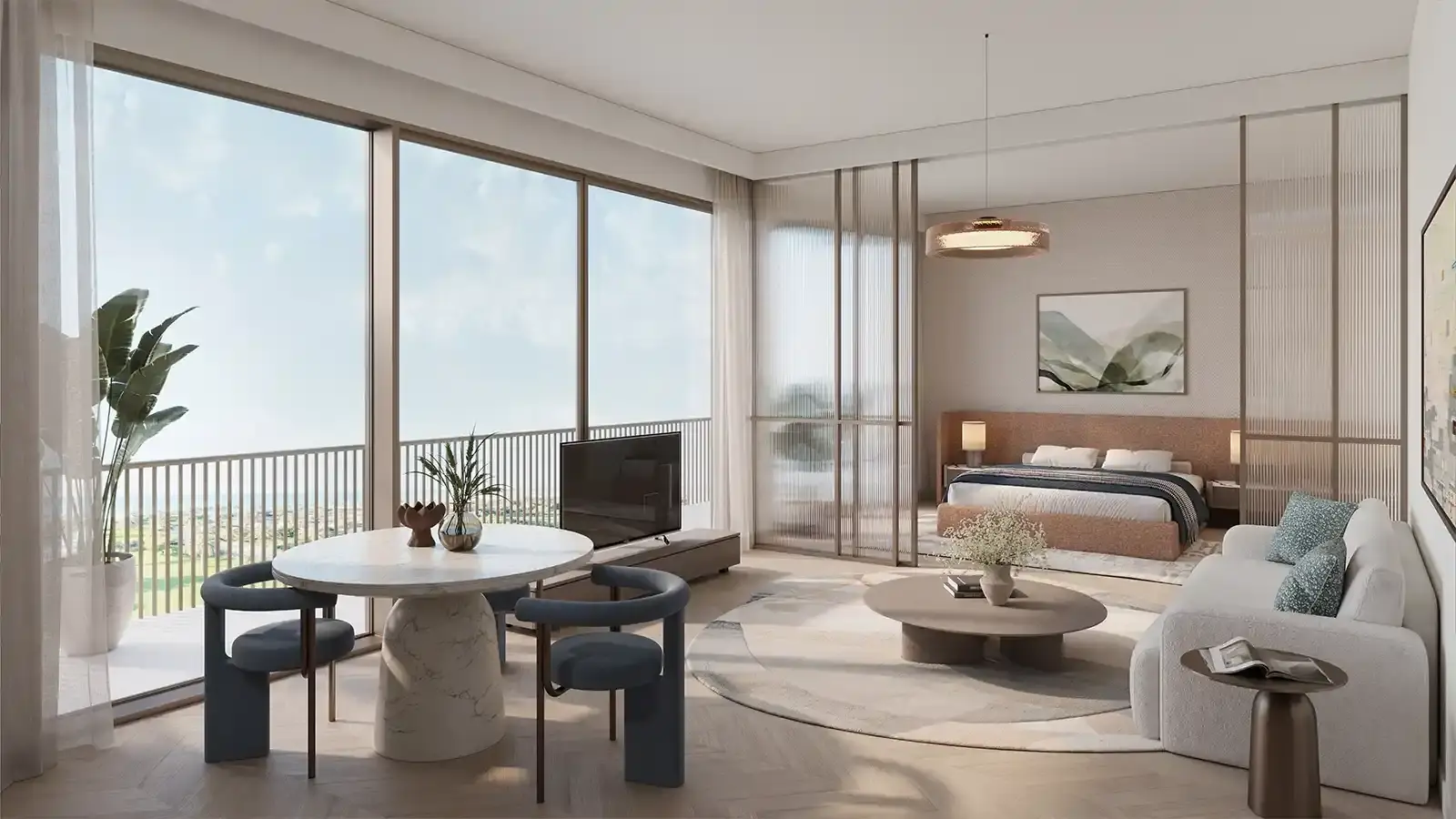 Nura – living area with dining table and glass-partitioned bedroom with balcony