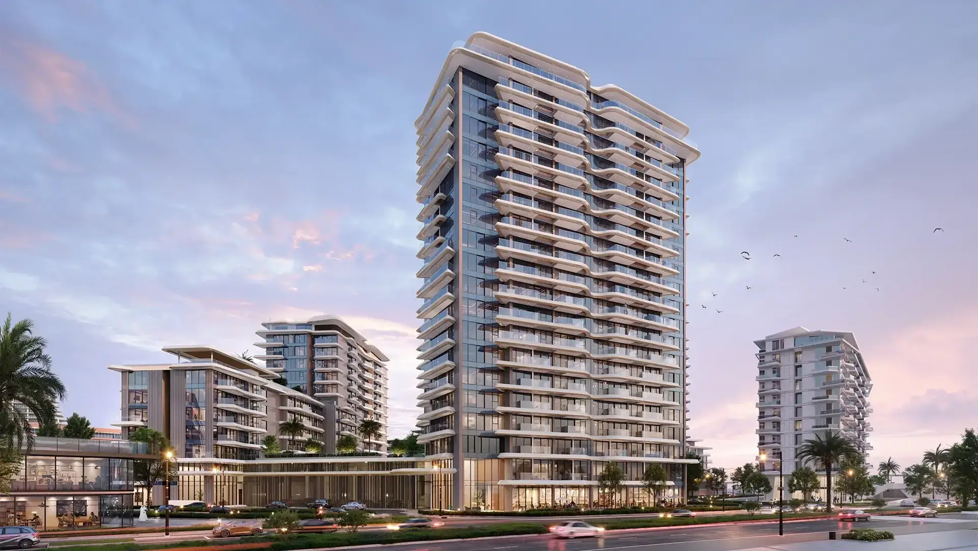 Solera – residential tower with balconies on a landscaped boulevard at dusk