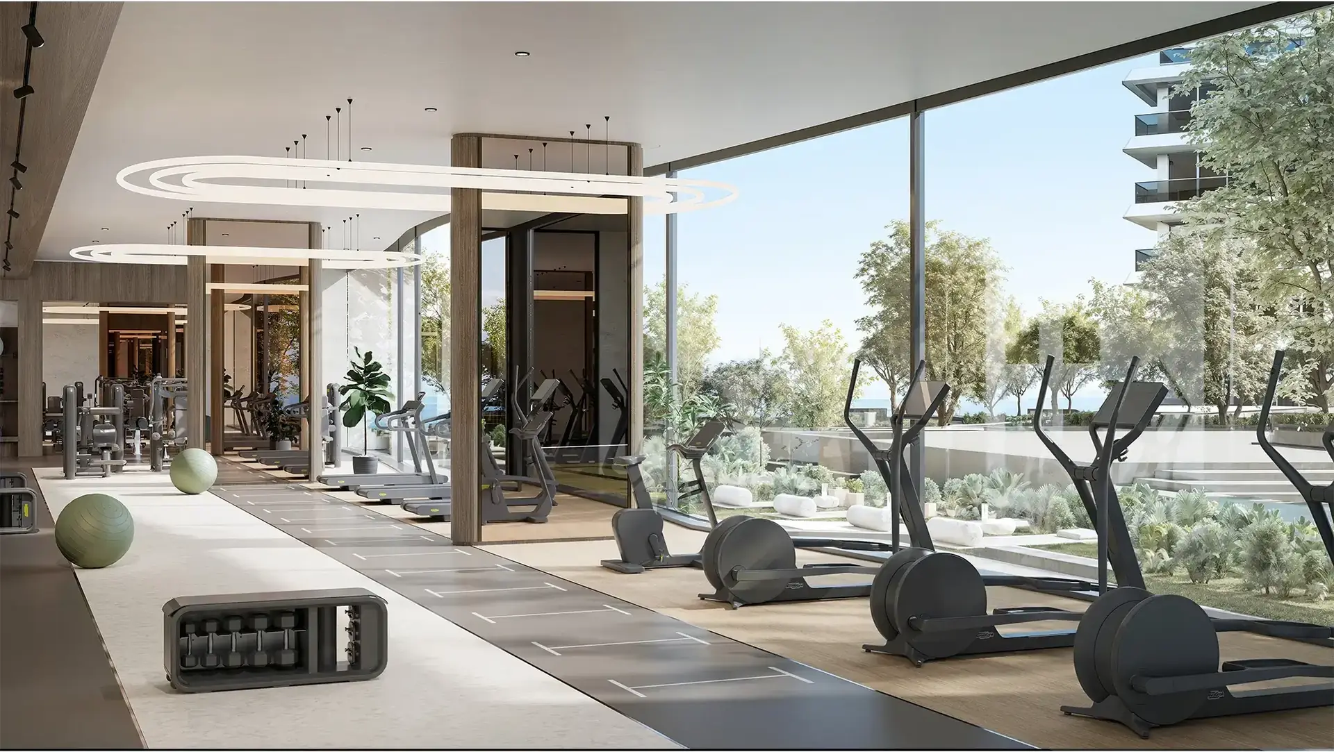 Solera – gym with cross trainers, free weights and floor-to-ceiling windows